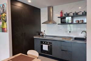 Woonvoorbeeld 2-kamerappartement staandaard, tuin- of zwembadzicht