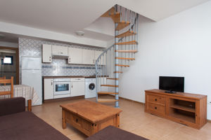 Woonvoorbeeld 2-kamerappartement met zwembadzicht